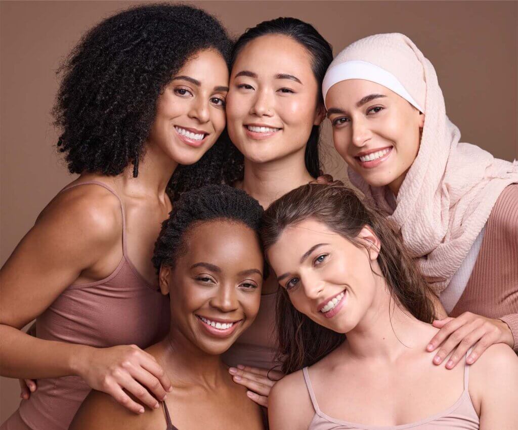Diverse women with healthy natural hair using natural hair products for growth
