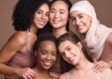 Diverse women with healthy natural hair using natural hair products for growth