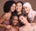 Diverse women with healthy natural hair using natural hair products for growth
